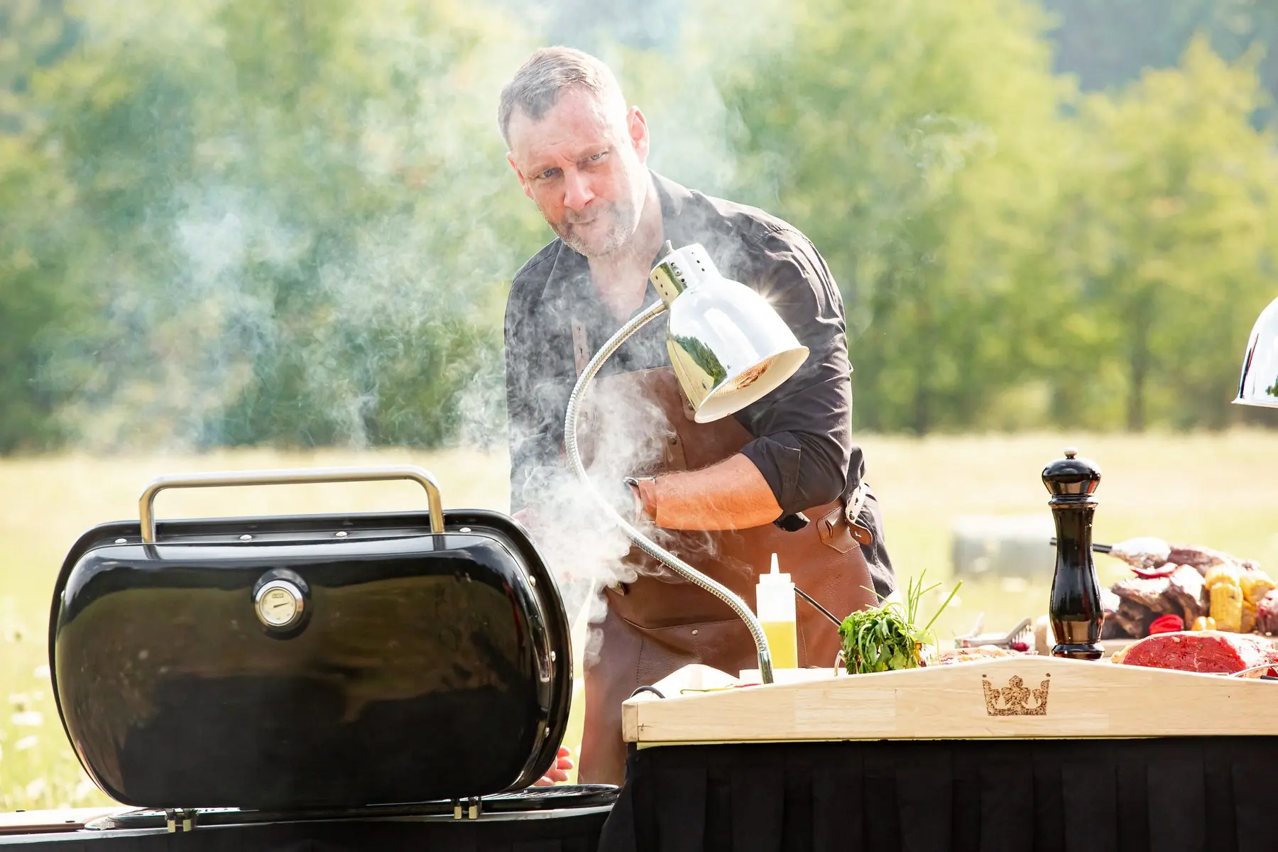 Garden party — Honza in the smoke by the grill in a meadow