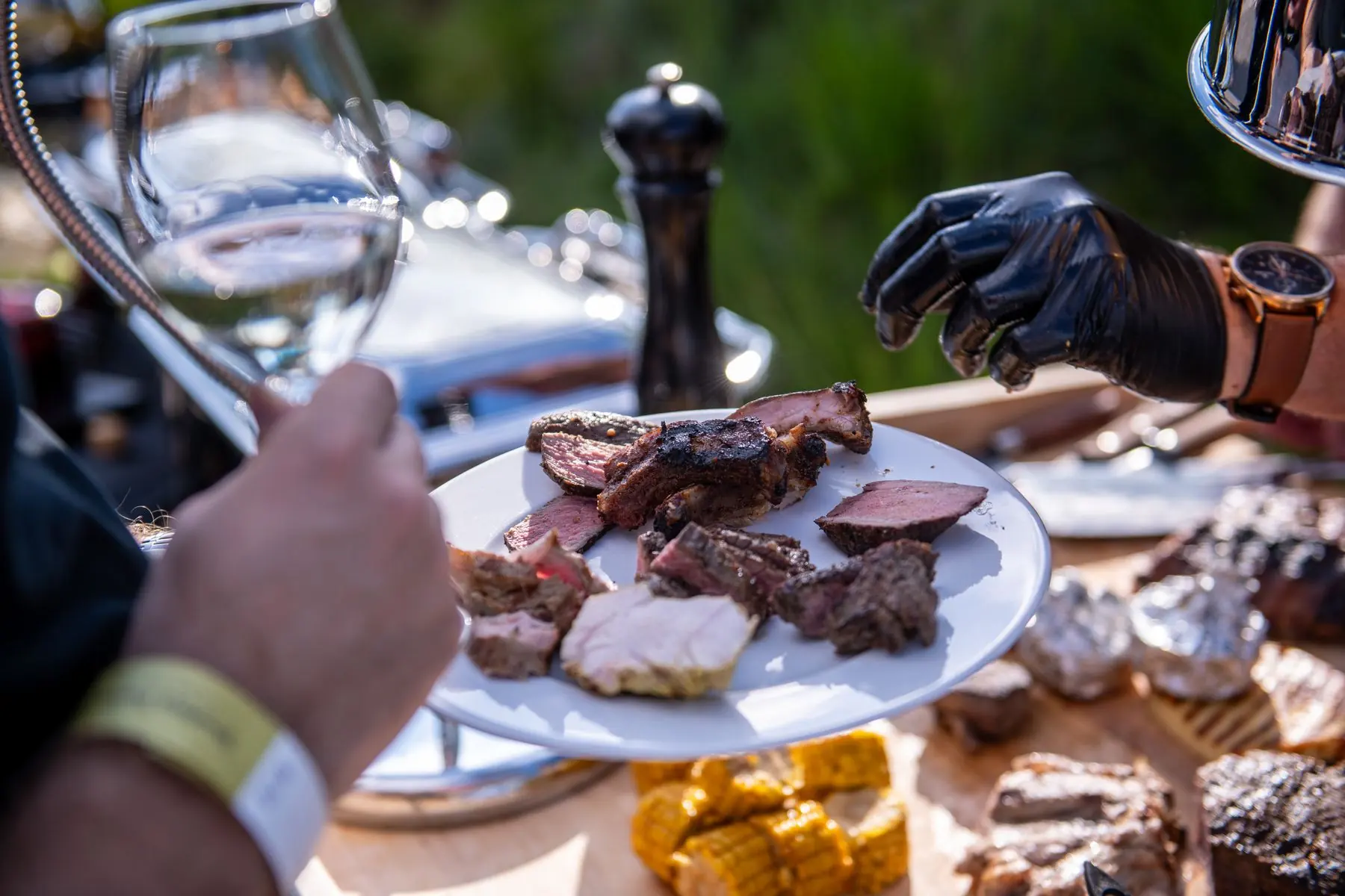 A plate of grilled meat served to a guest